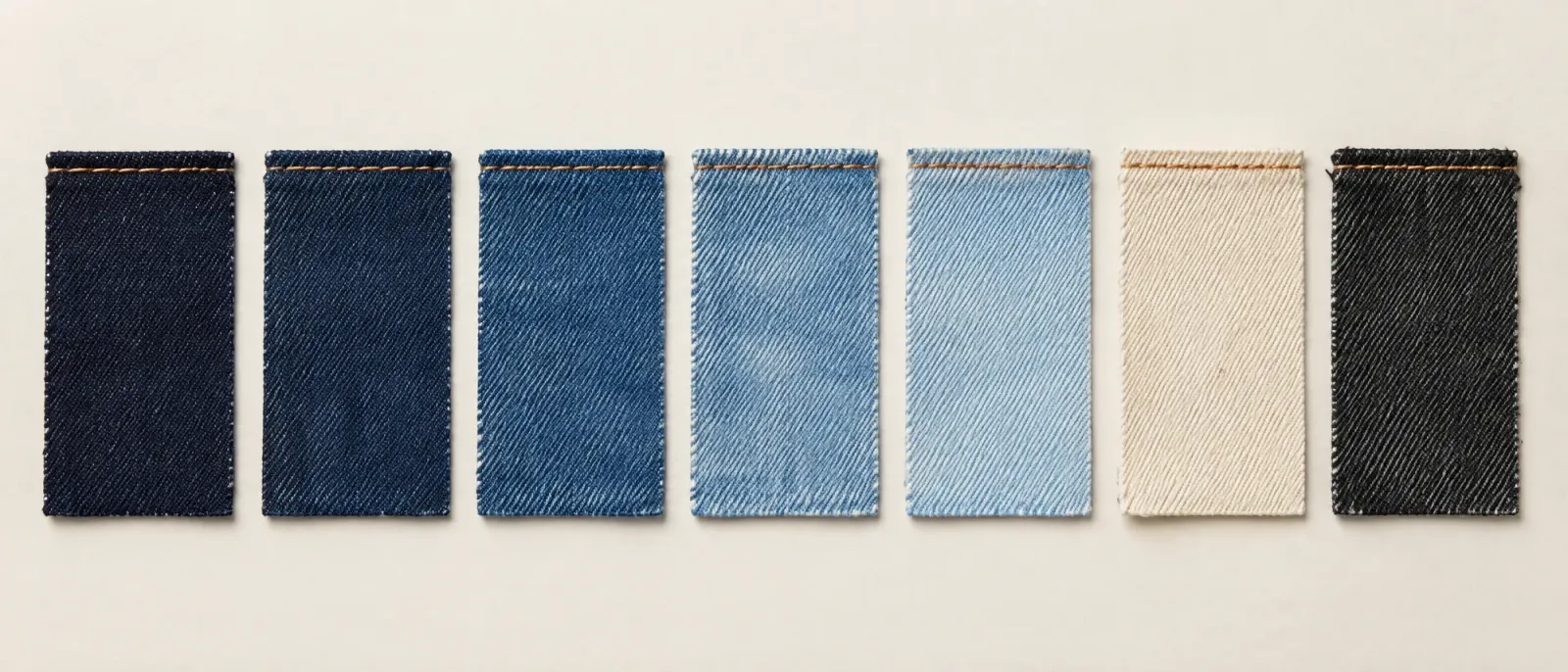 Seven SEAMVORO denim washes from raw indigo to ecru and worn black